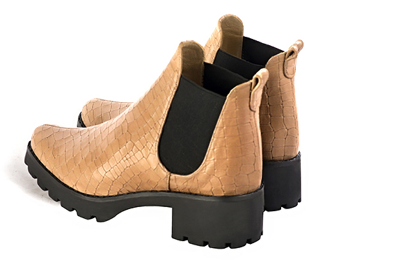 Camel beige and matt black women's ankle boots, with elastics. Round toe. Low rubber soles. Rear view - Florence KOOIJMAN